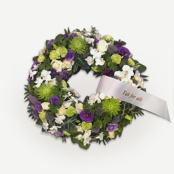 Rundpyntet krans med orkideer og bånd